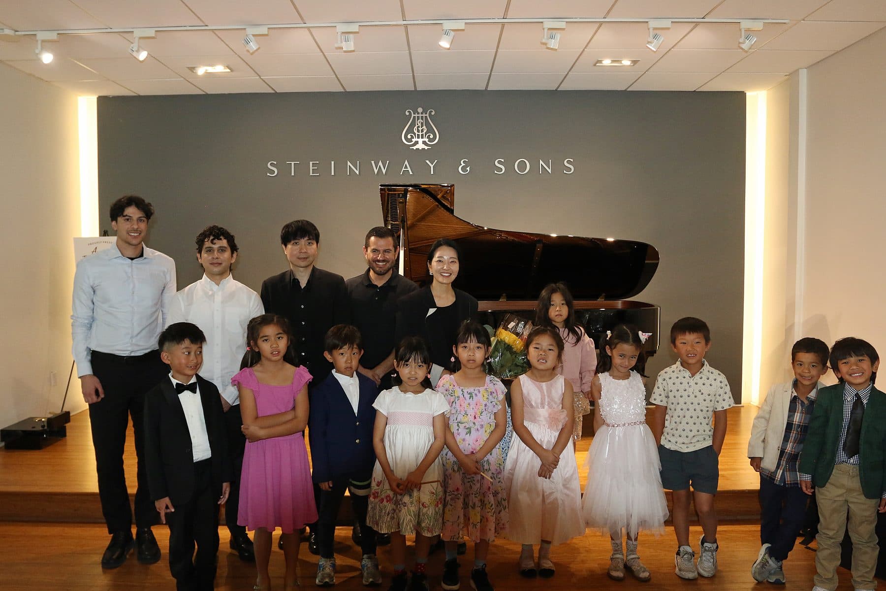 Students and teachers on stage after the 2025 recital