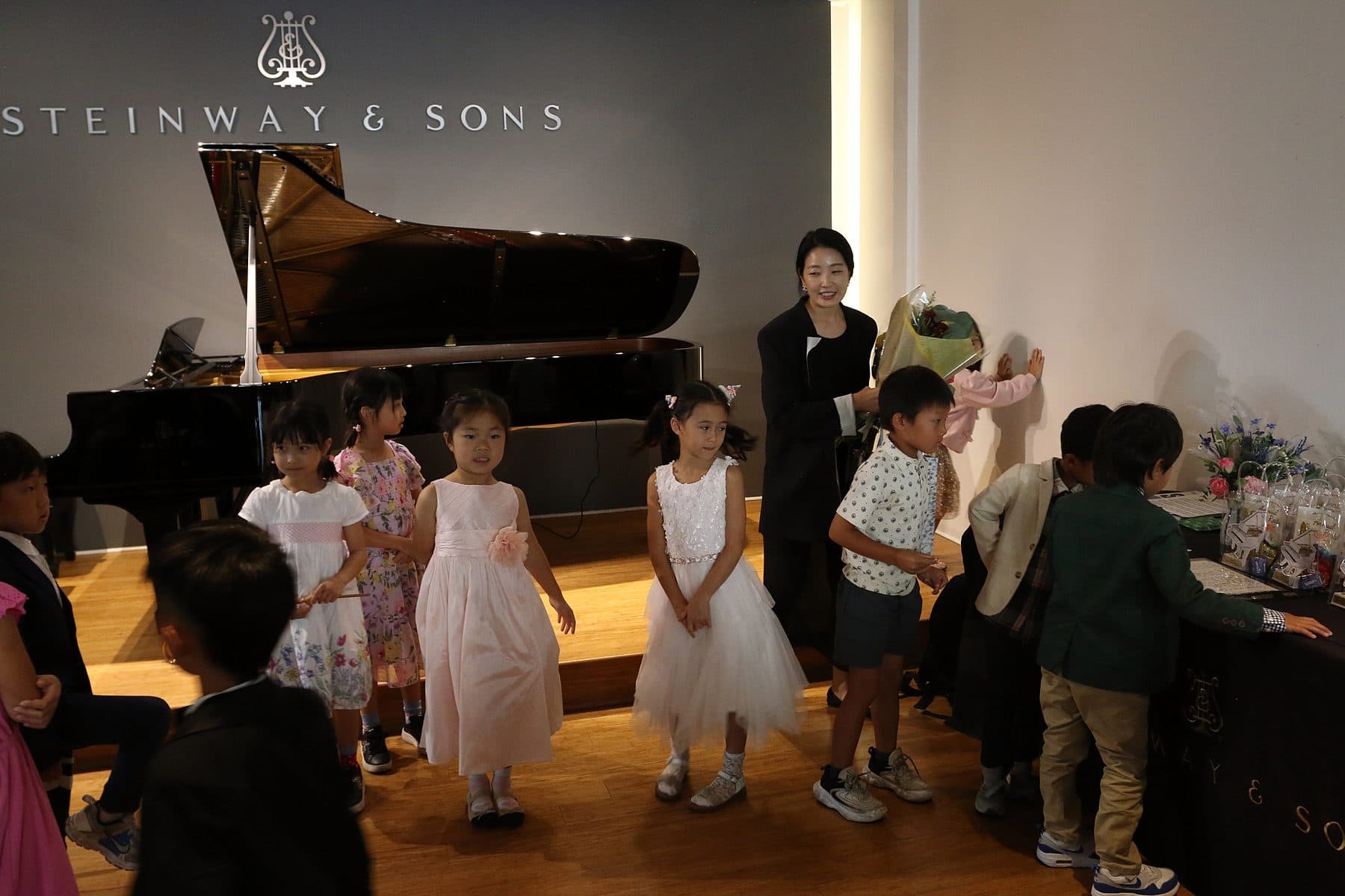 Yeaseul Kim with students by the Steinway